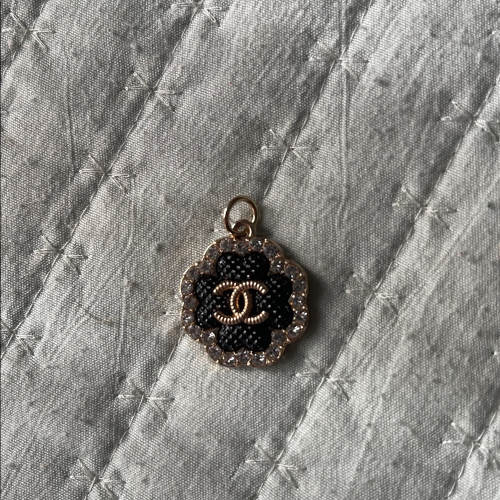 Chanel Black and Gold Clover Zipper Pull